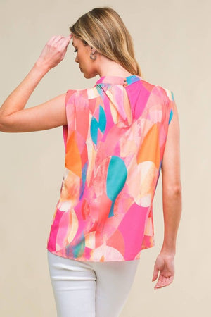 A printed woven top featuring high neckline, sleeveless and back button