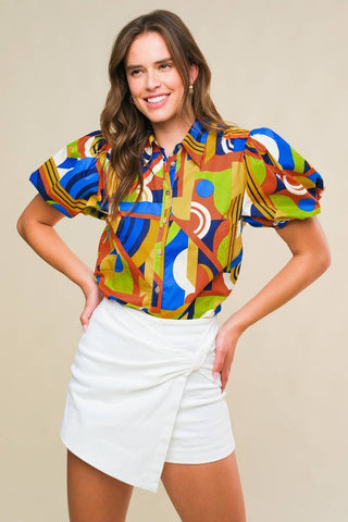 A printed woven top featuring shirt collar, button down and short puff sleeve