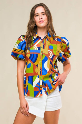 A printed woven top featuring shirt collar, button down and short puff sleeve