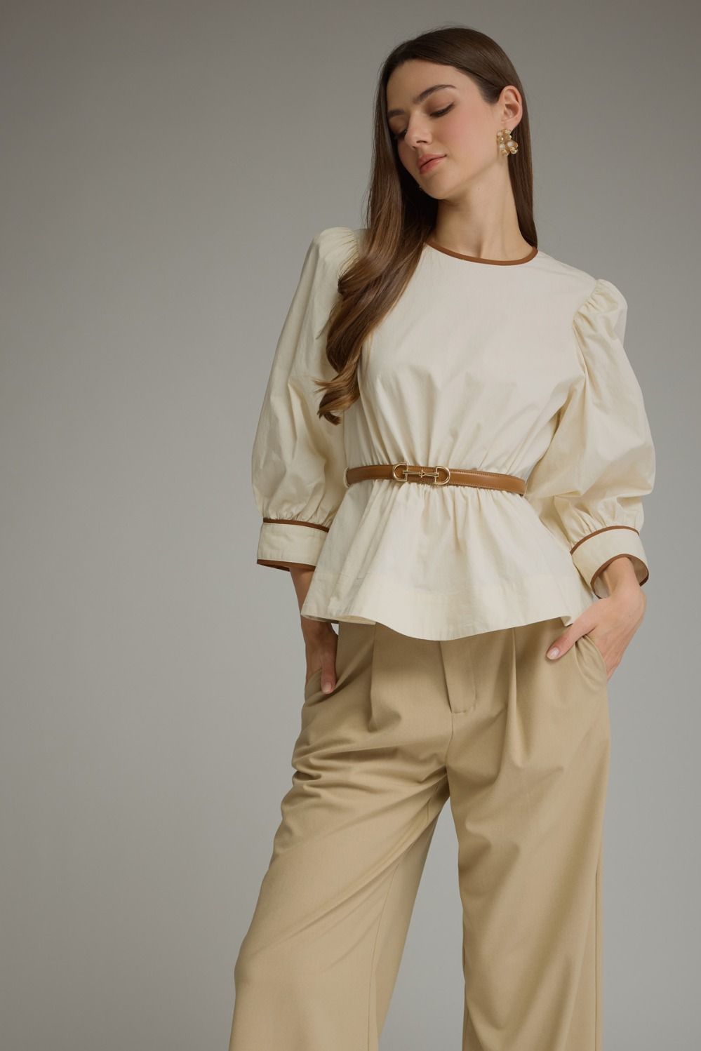 Solid long sleeve top with puff sleeves and contrast trim