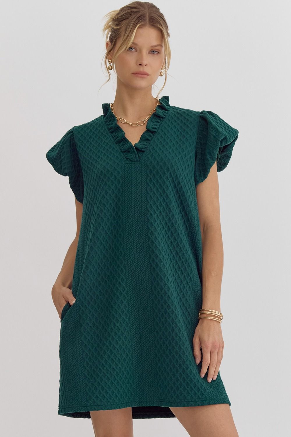 Textured short-sleeve v-neck mini dress featuring bubble sleeves.