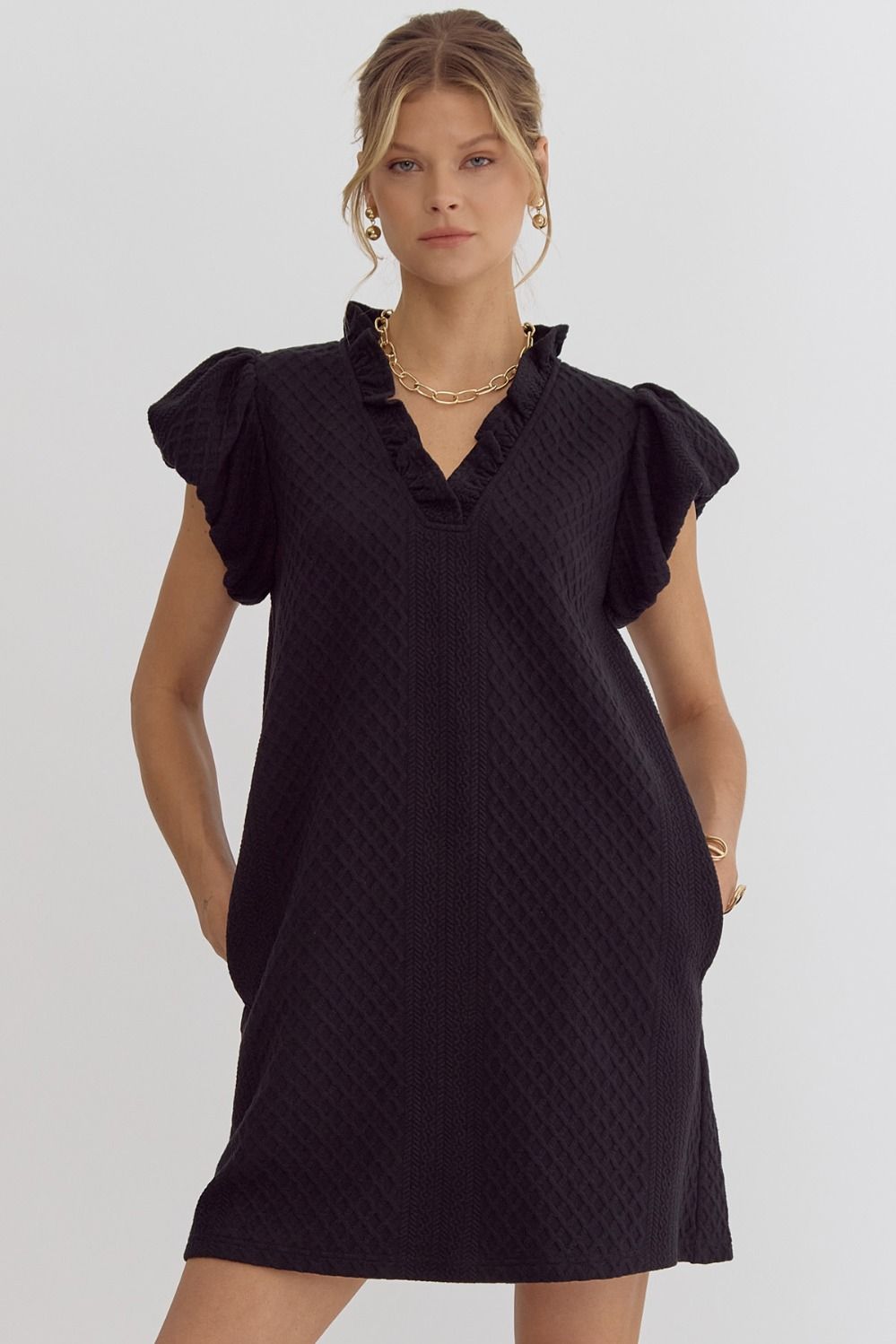 Textured short-sleeve v-neck mini dress featuring bubble sleeves.