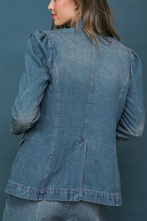 A washed denim blazer featuring front button closure, front pockets and long sleeve