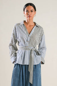 A striped woven top featuring surplice neckline, long sleeve, side button and peplum