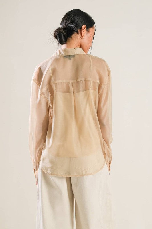 A solid organza top with contrasting collar and placket, long sleeve, button down and cami