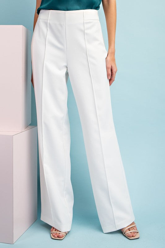 Solid full length pants featuring a wide leg style