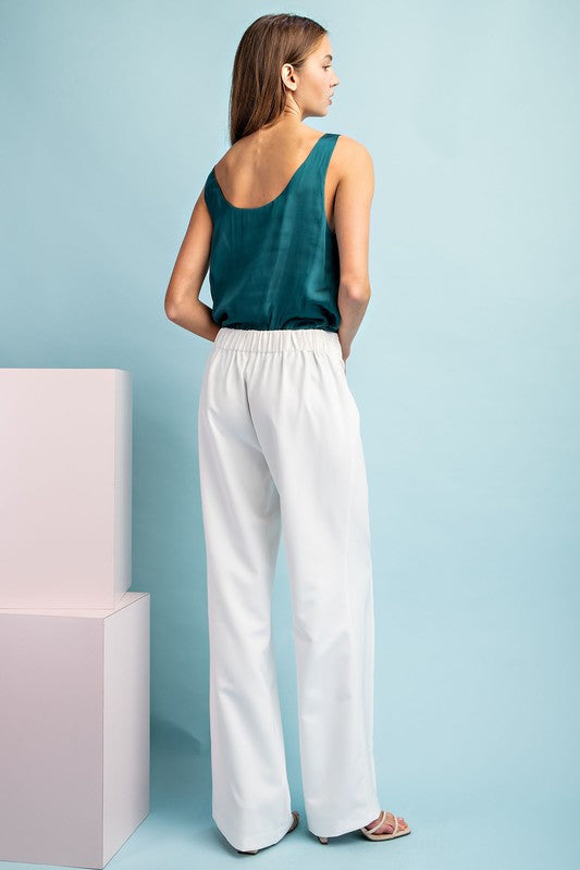 Solid full length pants featuring a wide leg style