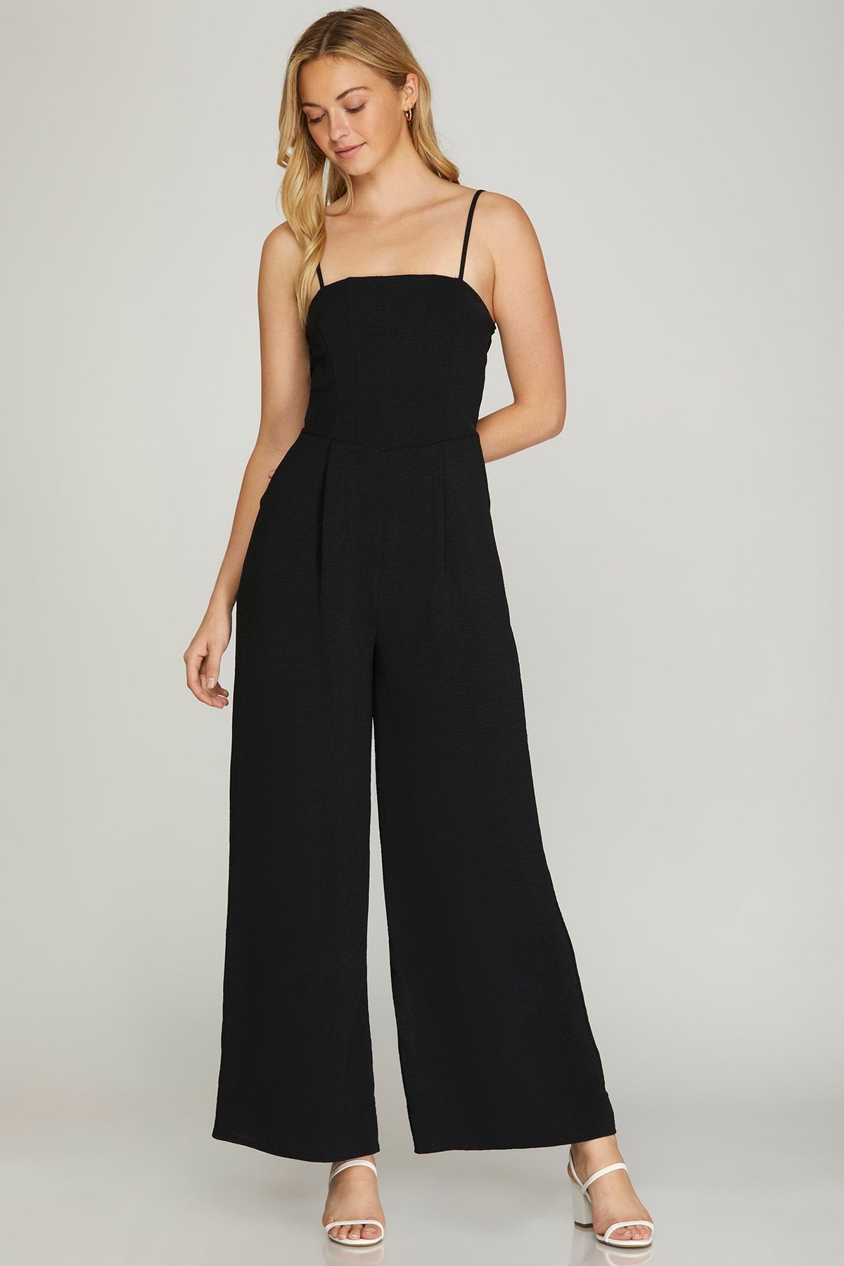 SLEEVELESS WOVEN JUMPSUIT WITH BACK SMOCKING DETAIL