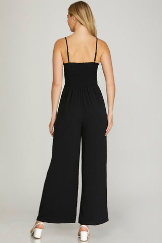 SLEEVELESS WOVEN JUMPSUIT WITH BACK SMOCKING DETAIL