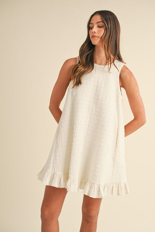 SLEEVELESS TEXTURED RUFFLE BUTTON BACK MINI DRESS