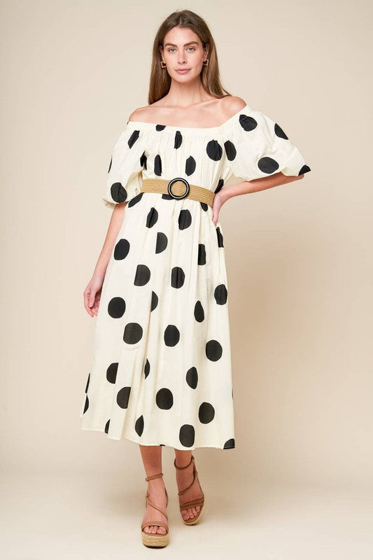 A printed woven midi dress featuring square neckline, short puff sleeve and belt