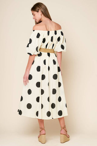 A printed woven midi dress featuring square neckline, short puff sleeve and belt