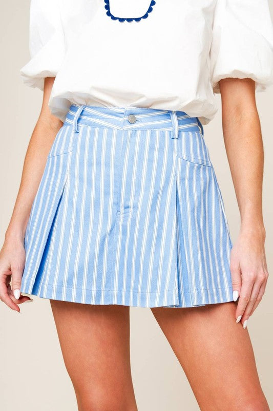 A striped woven skort featuring front closure and inverted pleats