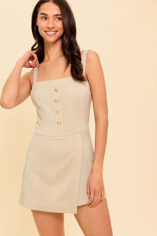 A solid woven romper