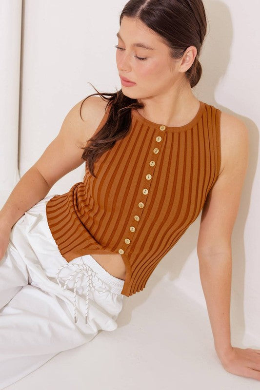 A ribbed sweater knit top featuring round neckline and button down