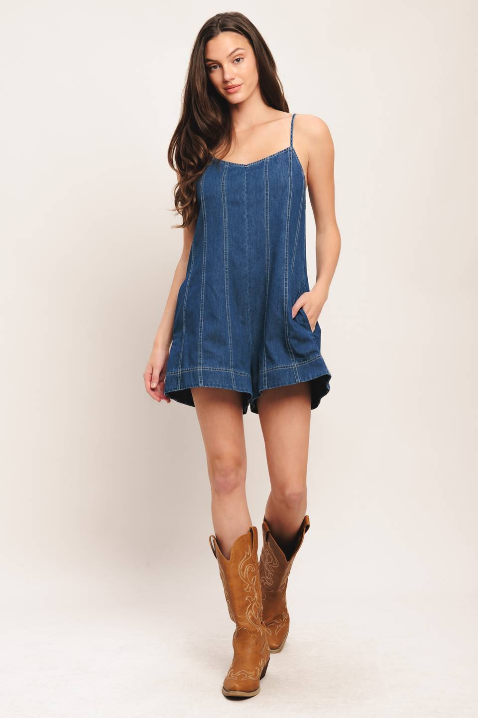 A Light Denim Romper with Back Tie and Zipper Closure
