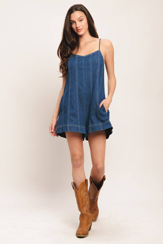 A Light Denim Romper with Back Tie and Zipper Closure