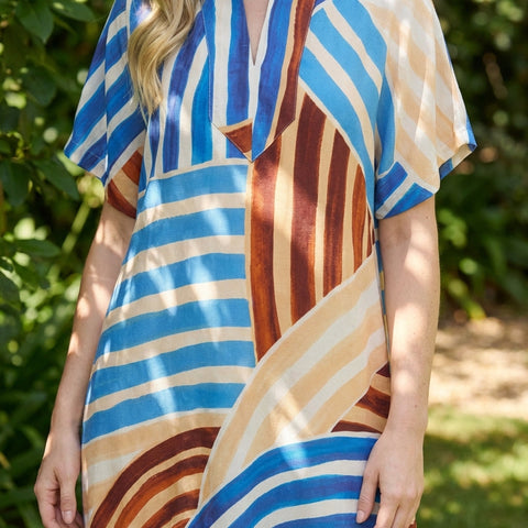 High-resolution close-up of Stripe Abstract Print Short Sleeve Midi Dress highlighting the vibrant multicolor pattern and woven fabric texture.