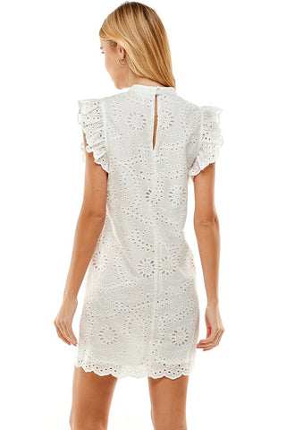 Eyelet mock neck dress, ruffled sleeves, with keyhole opening in the back.