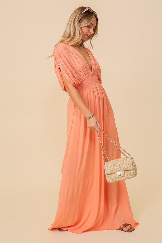 MAXI DRESS WITH SMOCKED WAIST. HAS BACK SELF TIE AND RUCHED SHOULDERS. PARTIALLY LINED.